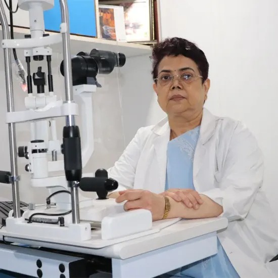 Dr. Rekha Chandra, Senior Phaco Surgeon at Sanjeev Netralaya, seated at a slit lamp.